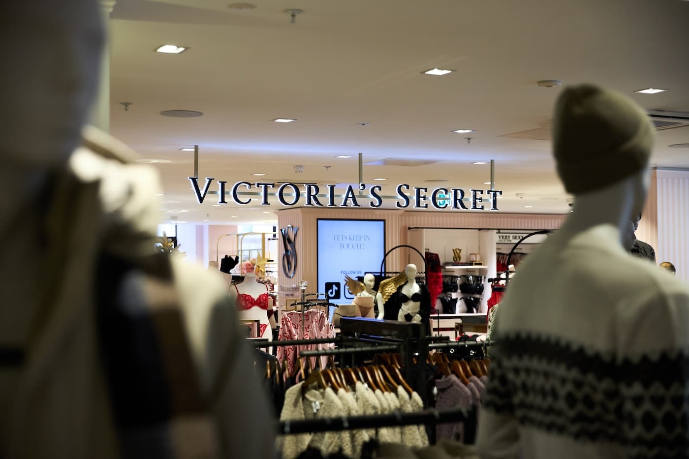 Interior of a Victoria’s Secret store with lingerie displays, mannequins, and branded signage.